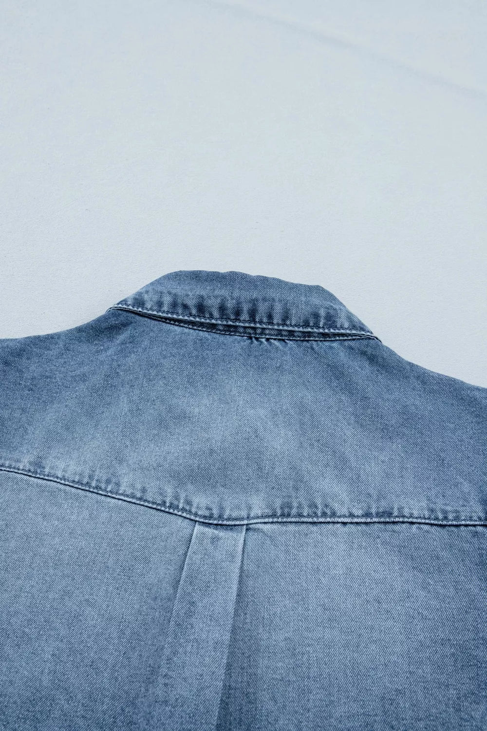 Medium wash frilled snap button denim shirt front view