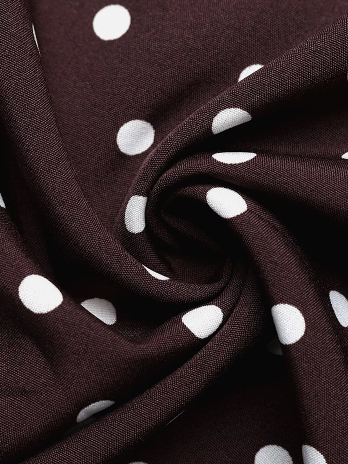 brown polka dot halter neck maxi dress hemline detail