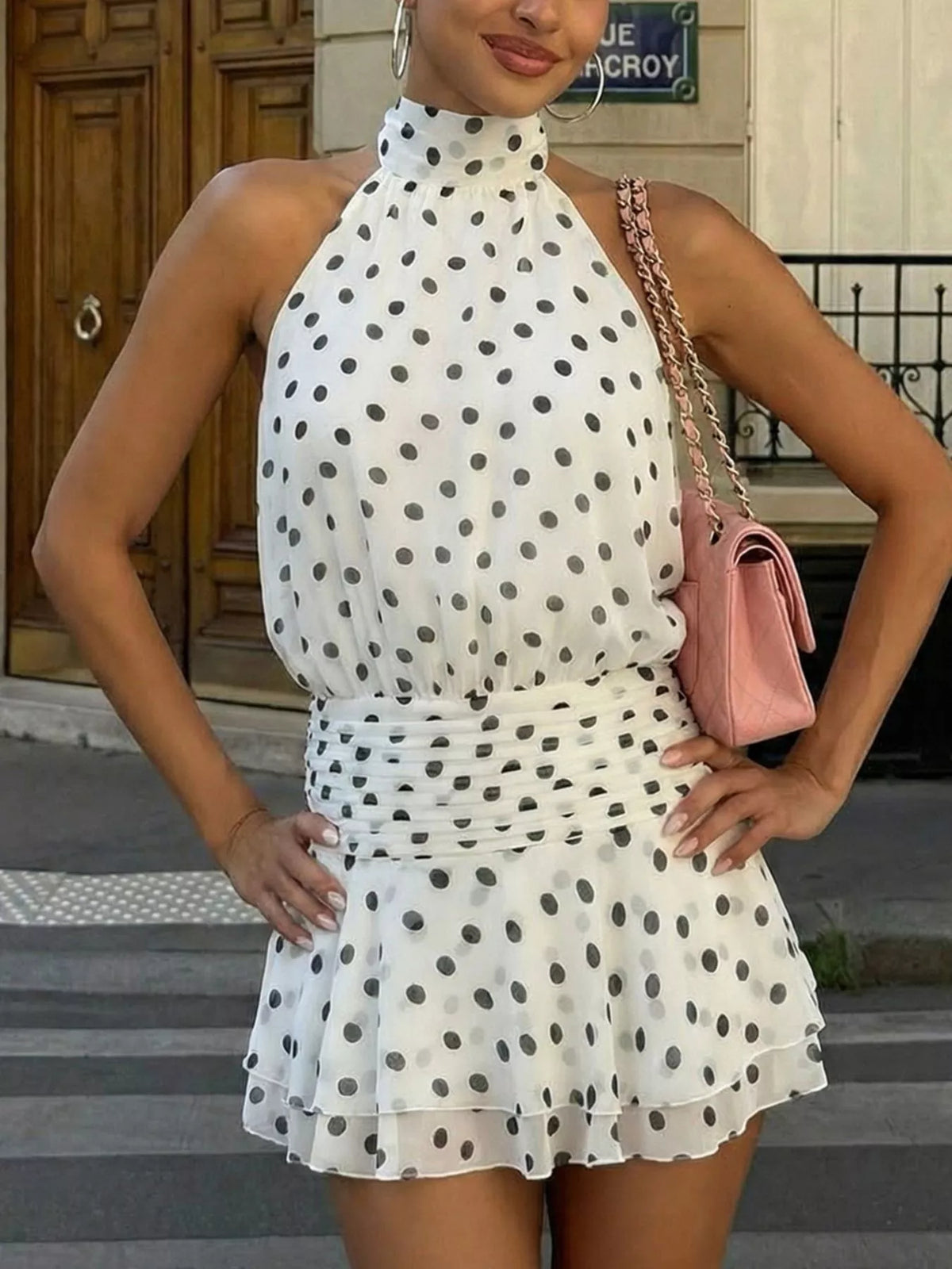 Halter neckline and tie detail on the polka dot dress