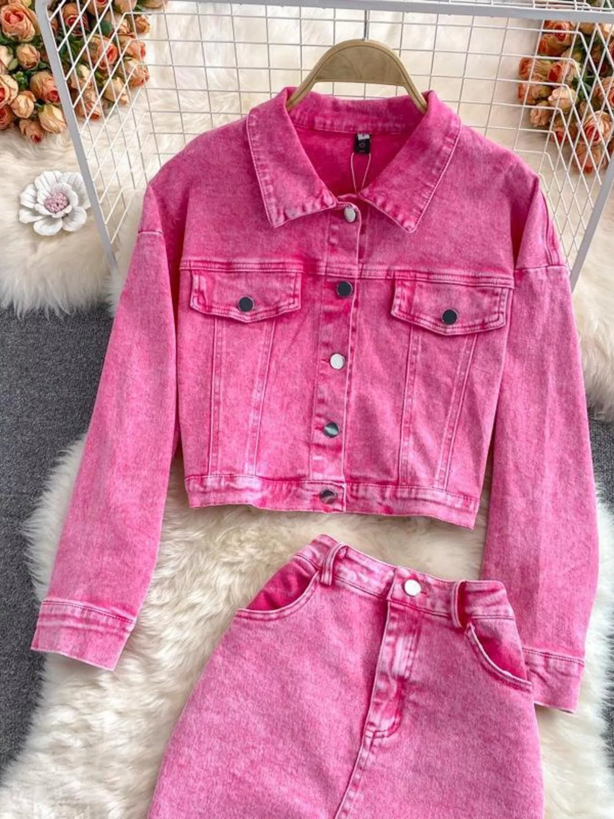 Pink denim jacket button detail
