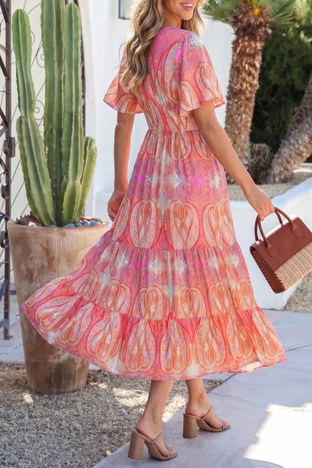 Tiered paisley maxi dress shown from the side on a model