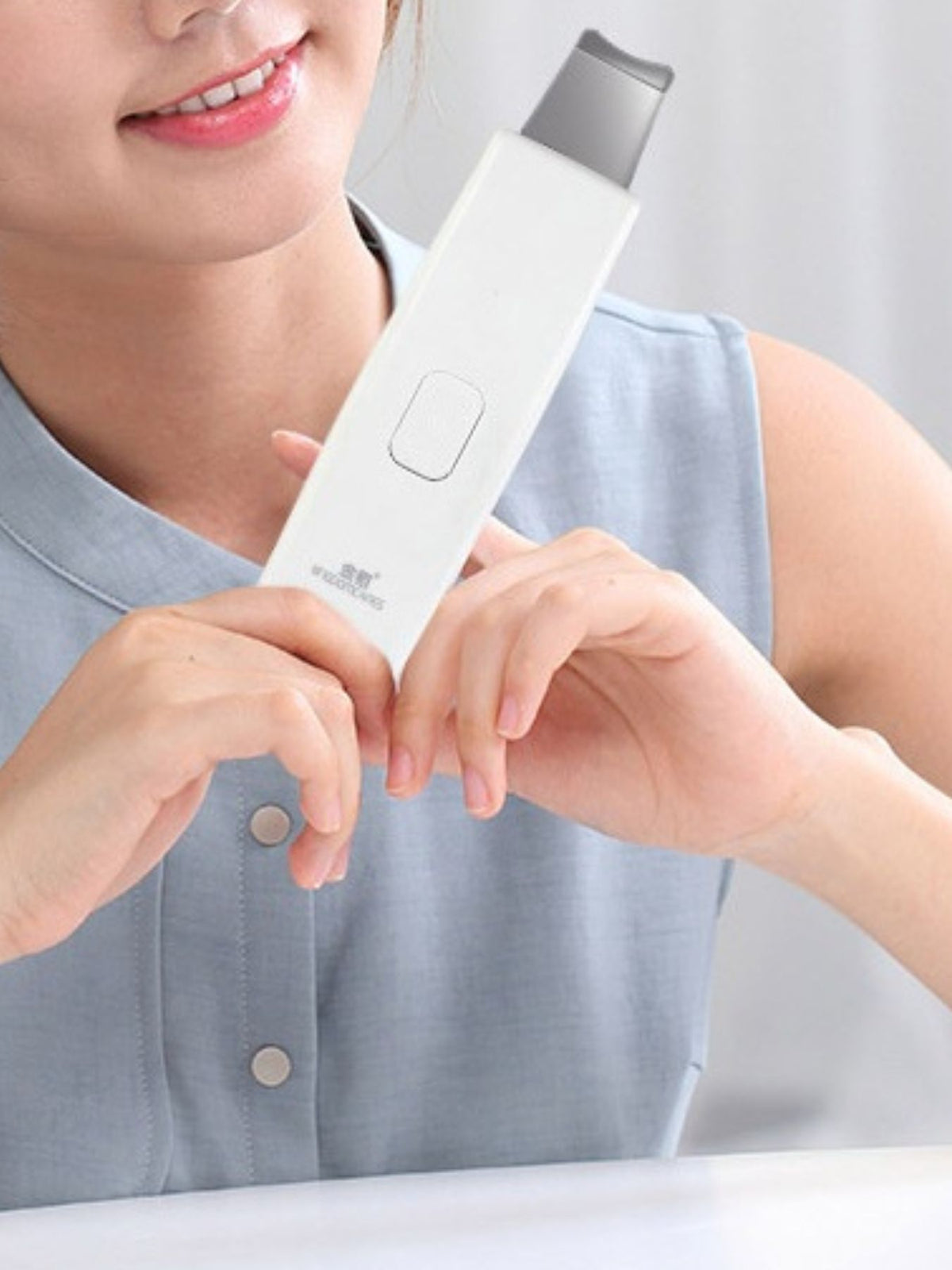 Facial scrubber held in hand