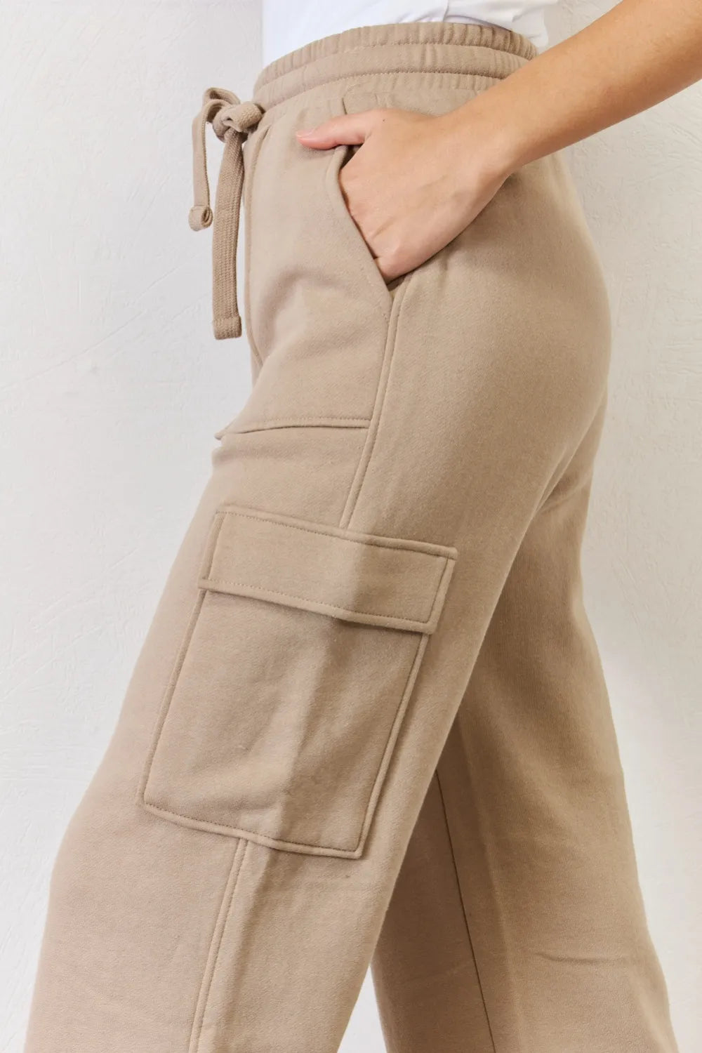 Full length styling of wide leg cargo pants on model