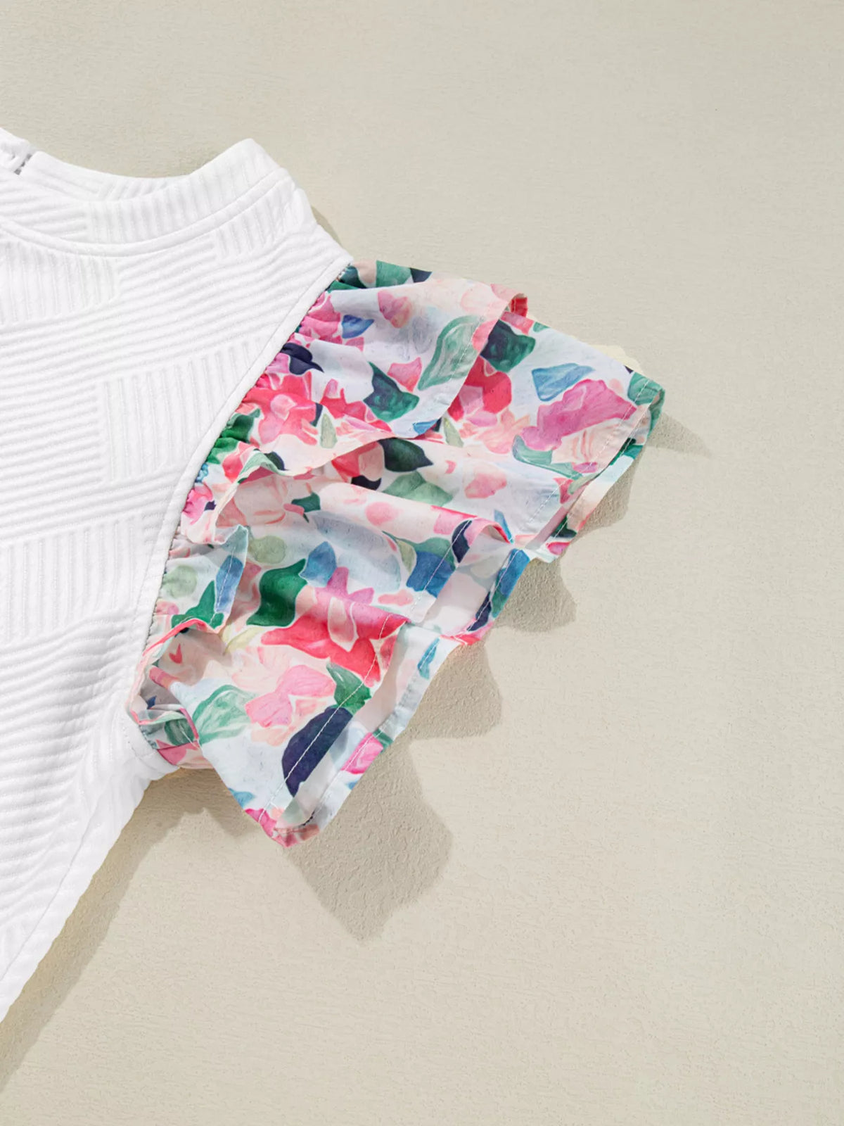 White abstract print tiered ruffle sleeve top back view