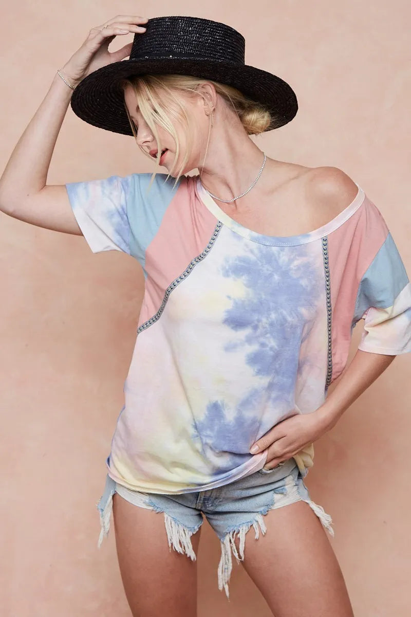 Tie dye top worn with denim shorts