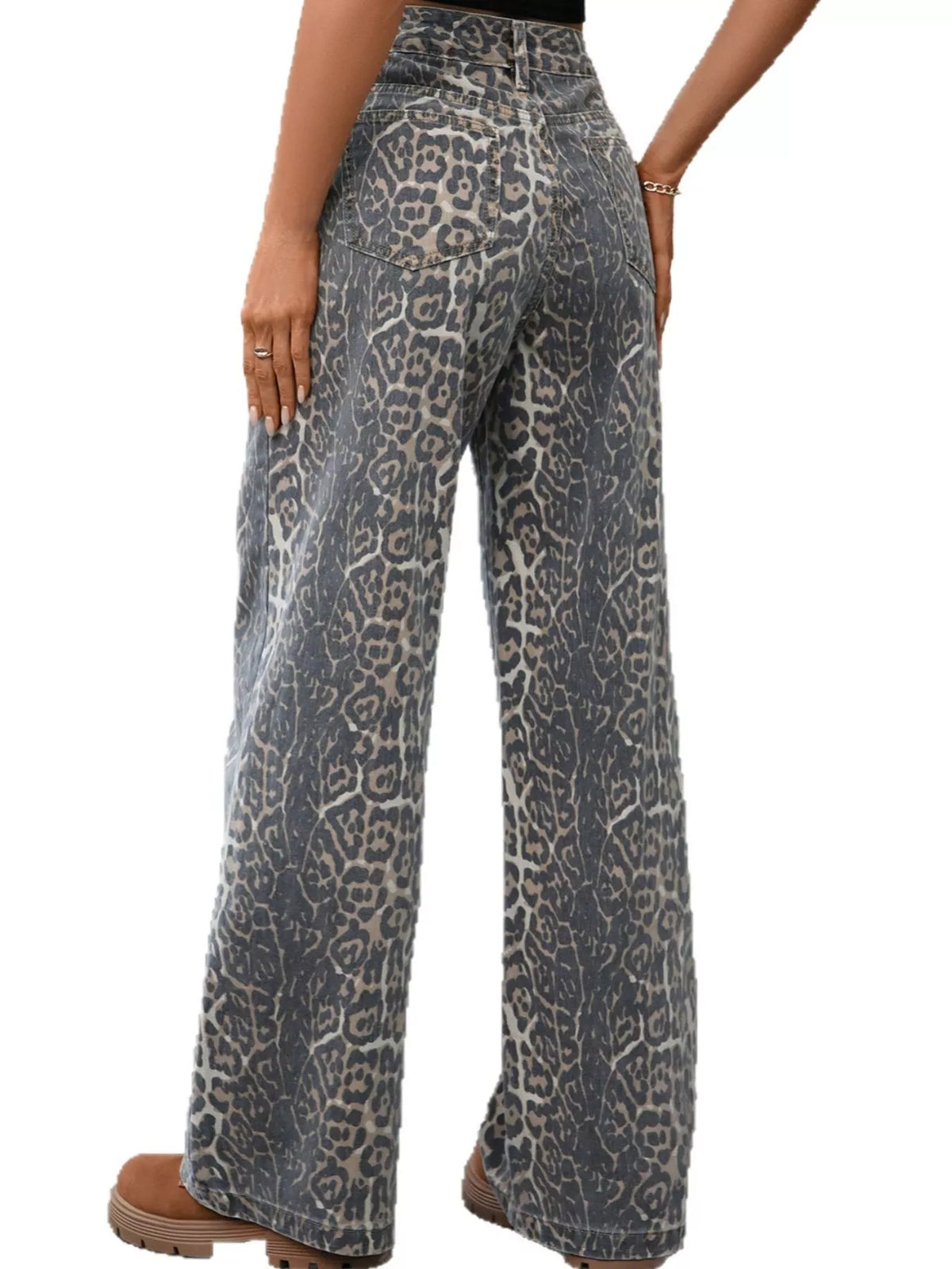 Model wearing leopard wide leg jeans