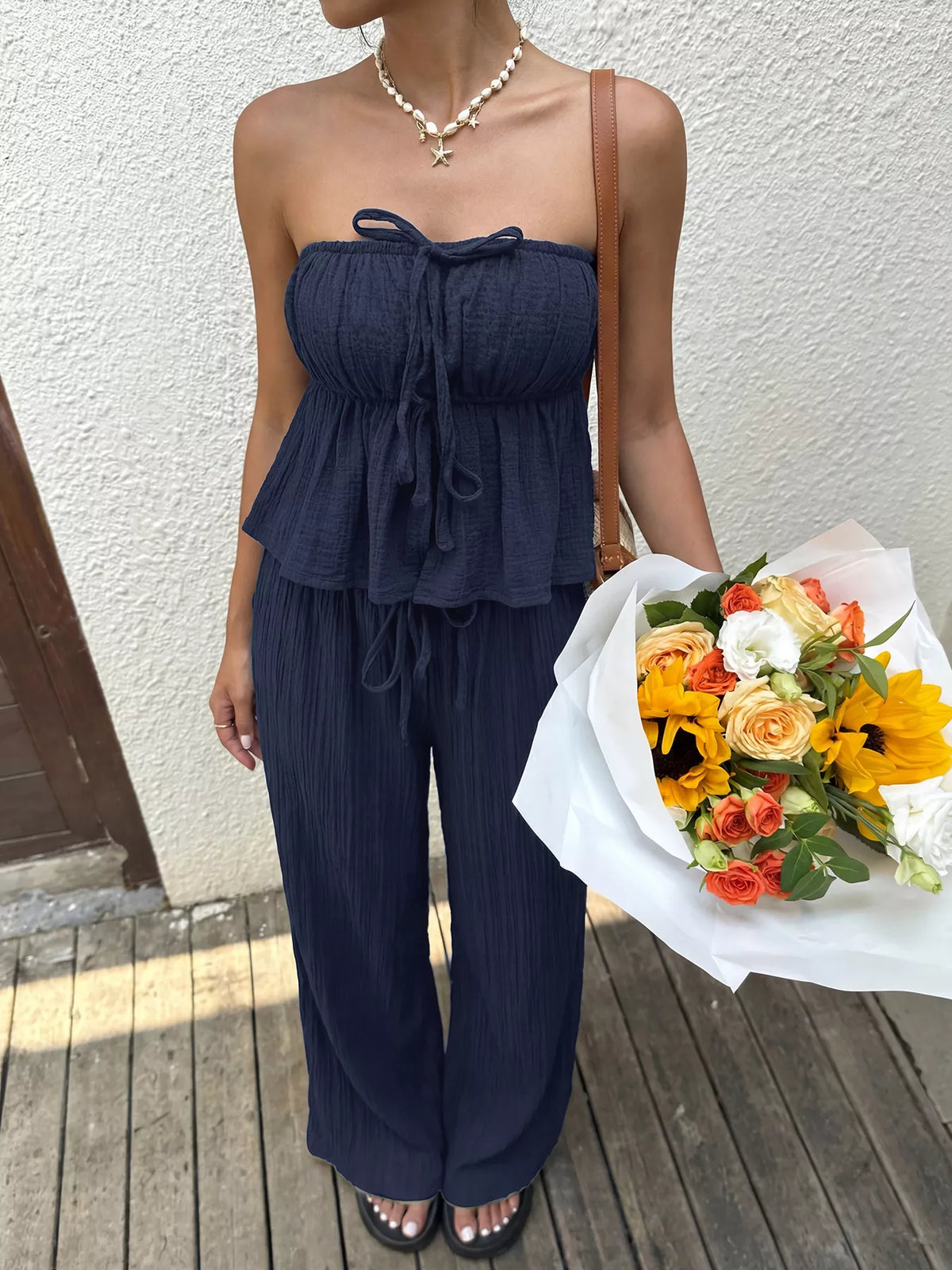 Navy strapless two piece wide leg set styled