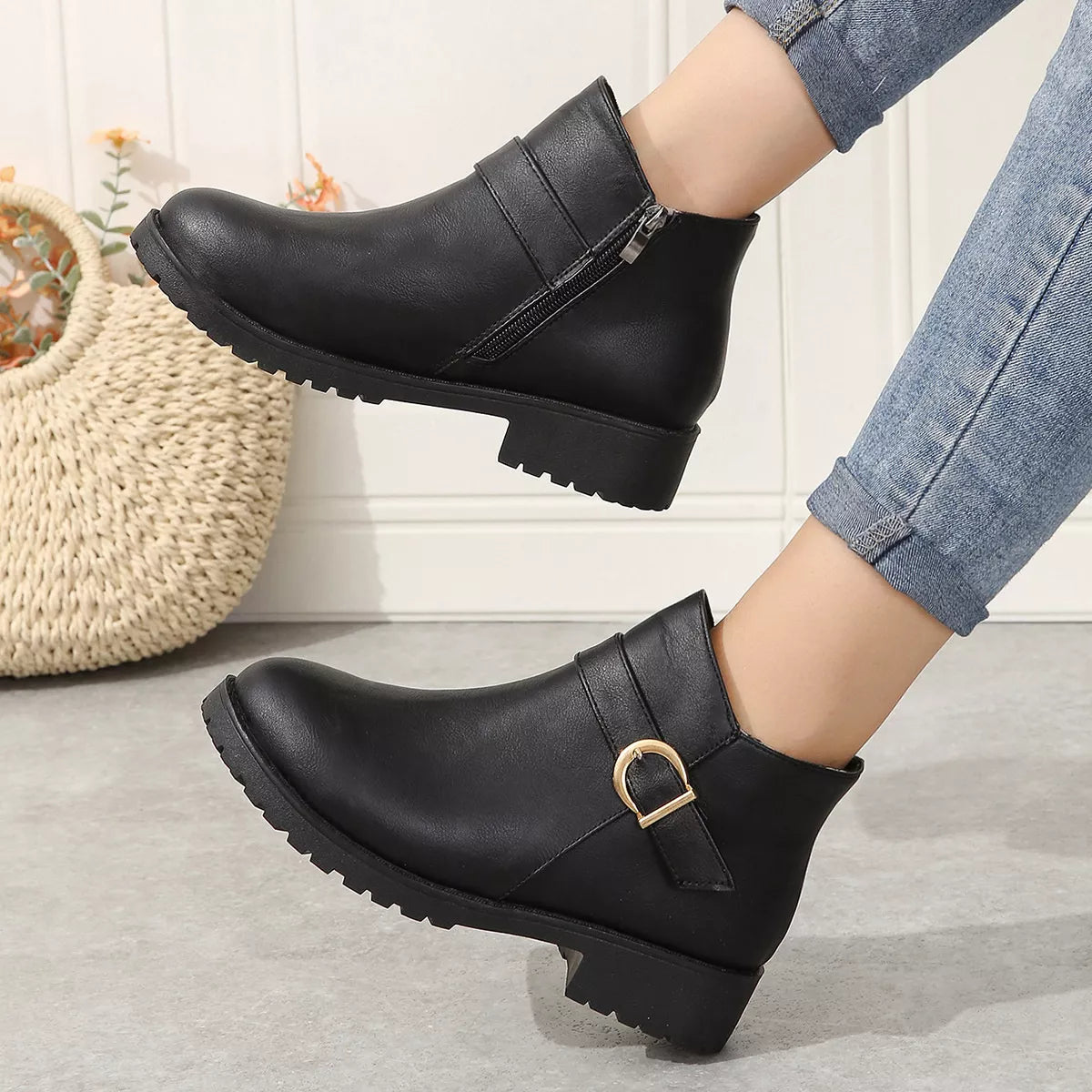 Buckle accent ankle boots pair styled together