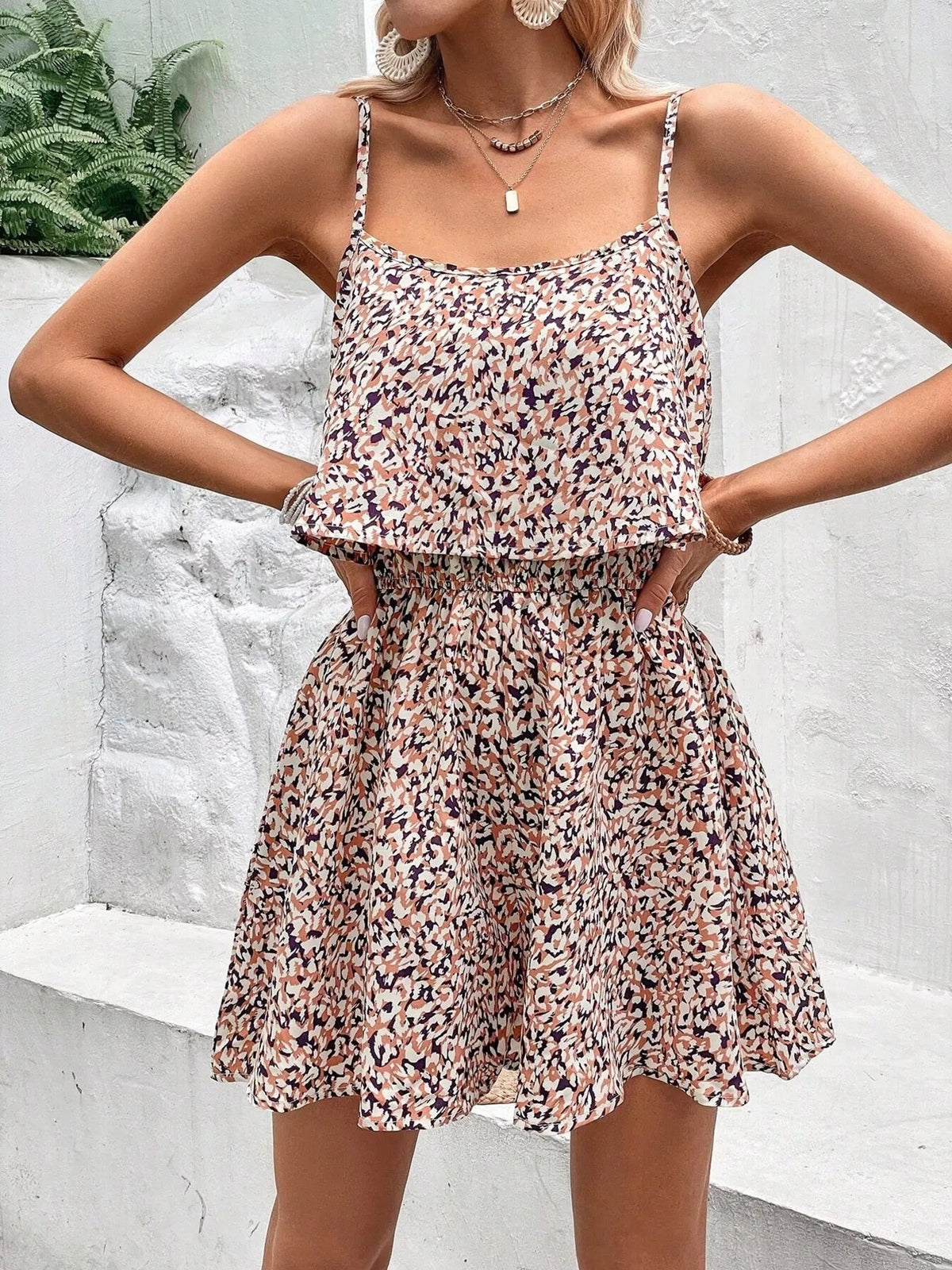 Close up of the allover print on a brown romper
