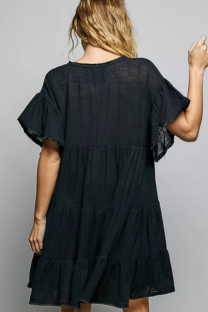 Ruffle accent and tiered skirt on the POL dress