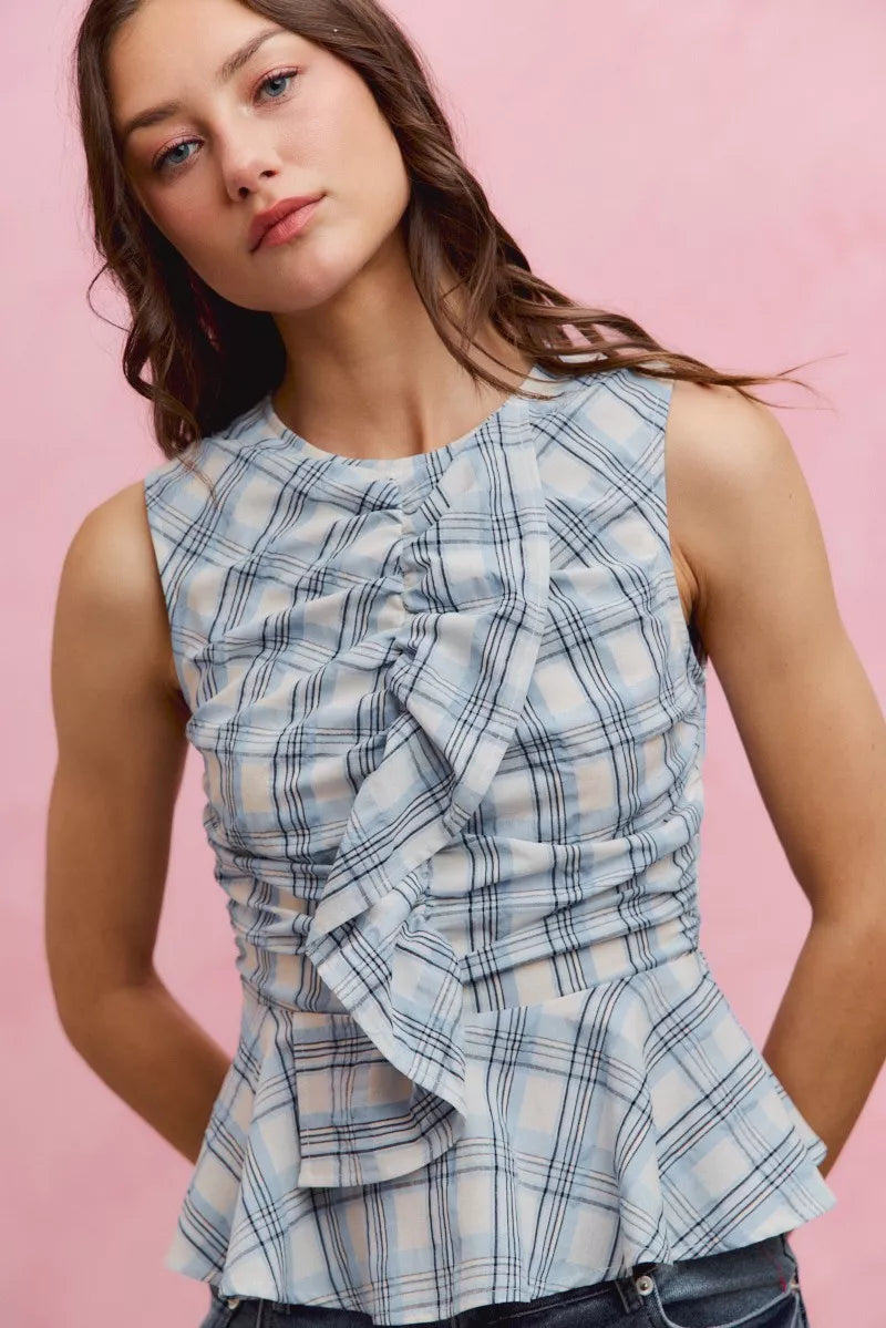 Blue plaid sleeveless ruffle peplum top front view