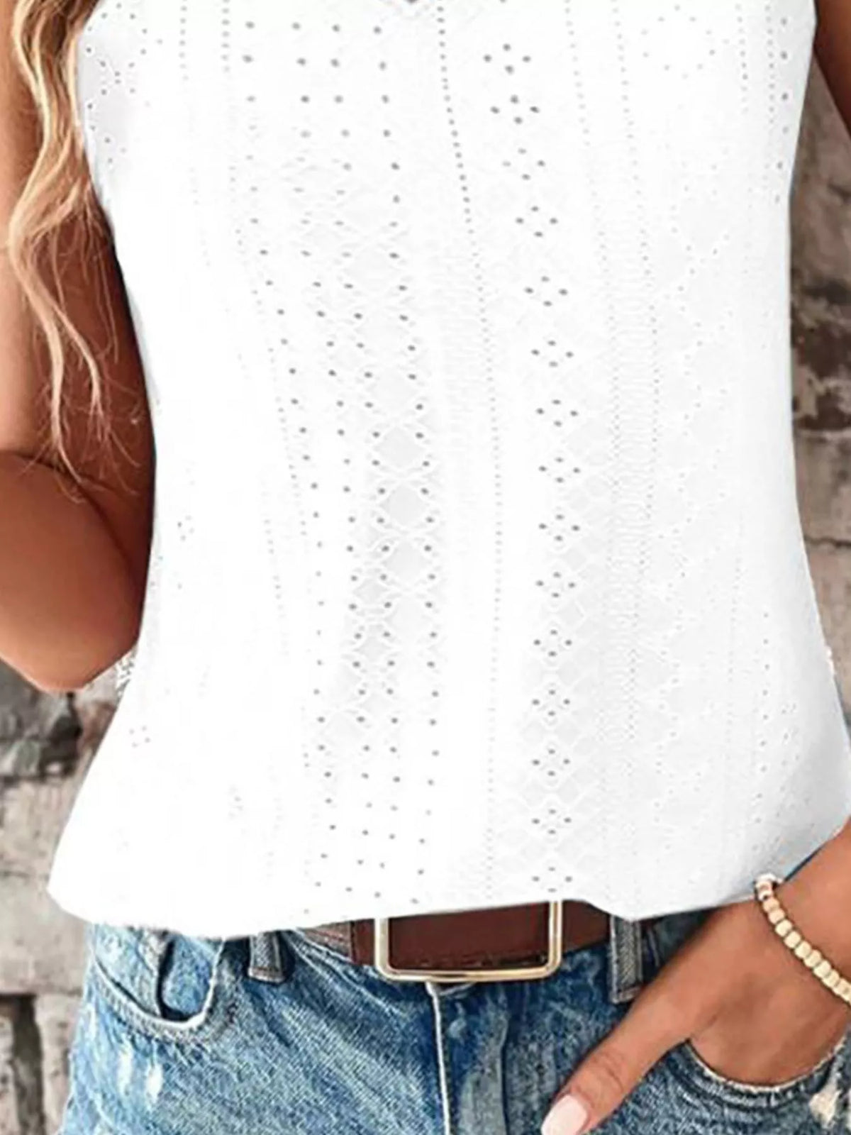 Angled view of the V neck eyelet trim tank top