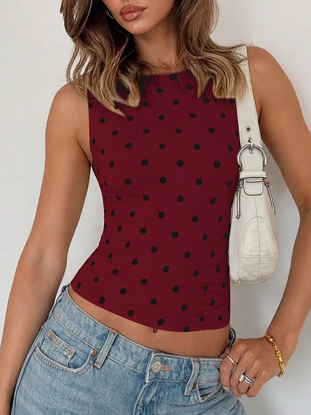Strap detail on the polka dot tank top