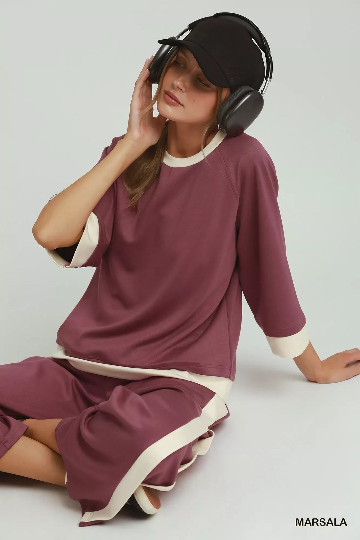 Back view of the marsala colorblock straight leg pants on a model