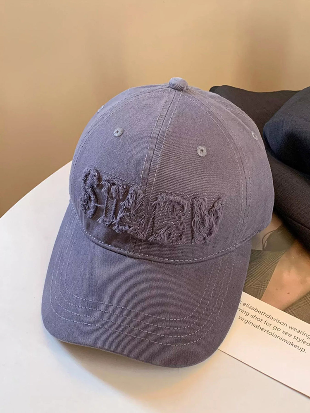 Milky white cotton cap shown from the front