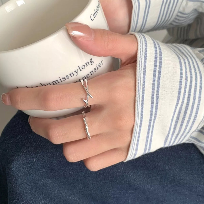 Sterling silver open ring worn on the hand