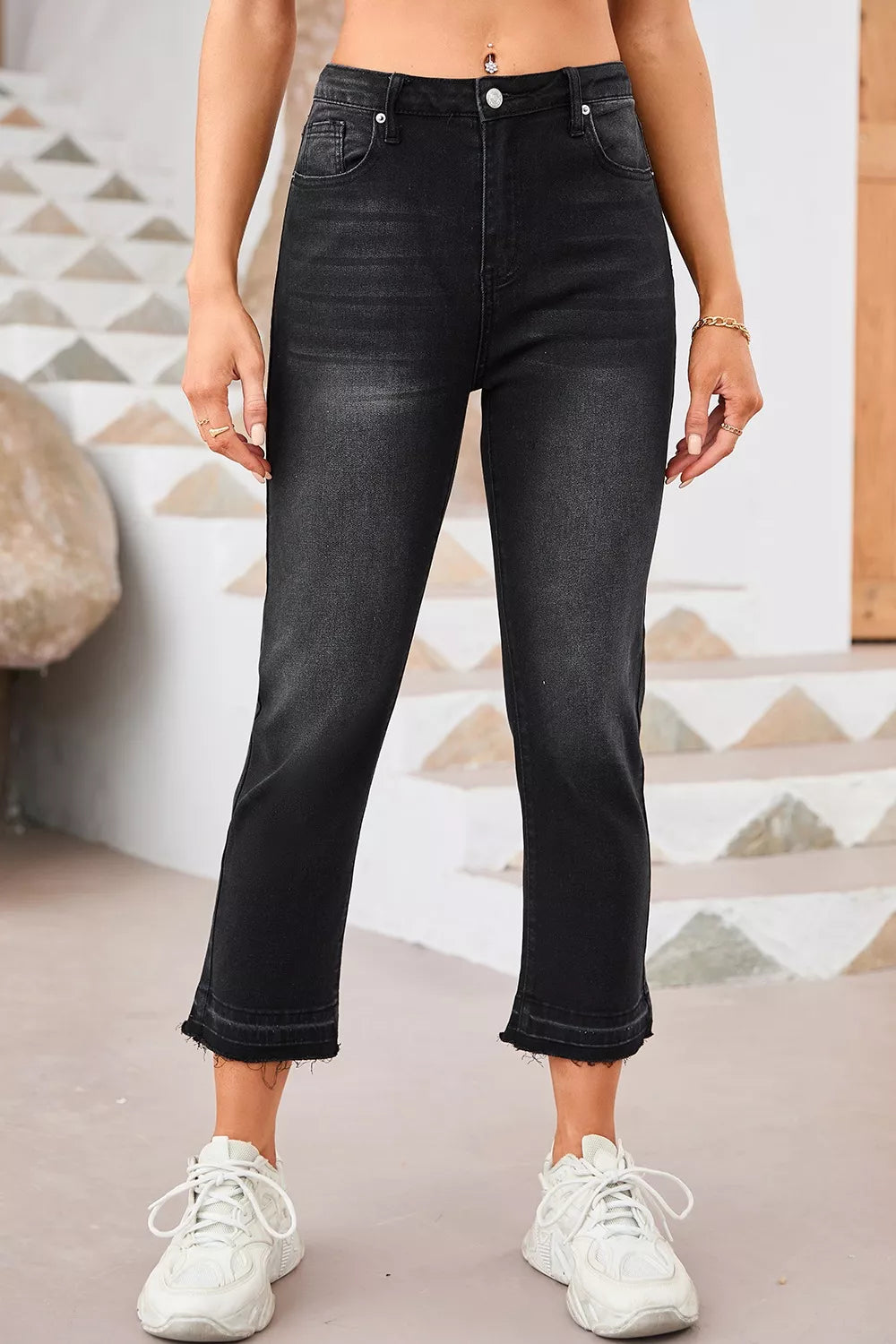 Back view of black high waisted straight leg jeans with pockets