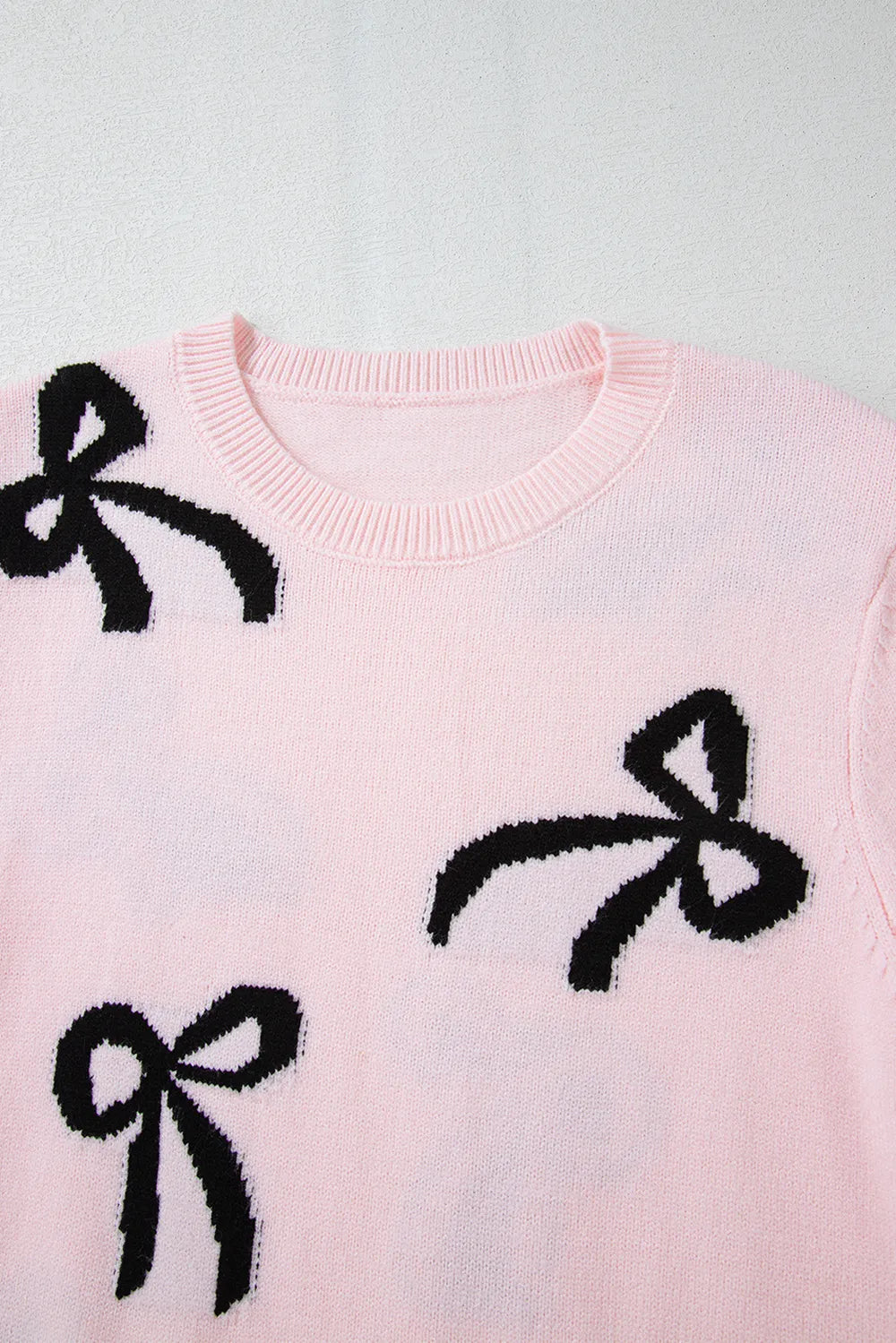 Blush bow pattern sweater styling look