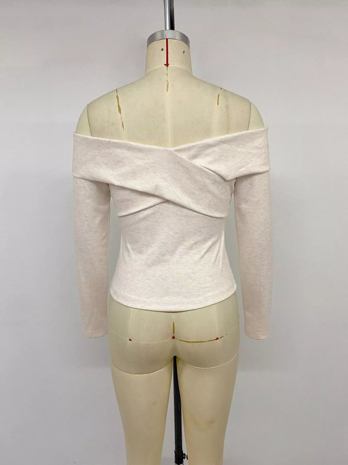 Off shoulder crisscross top seated styling view