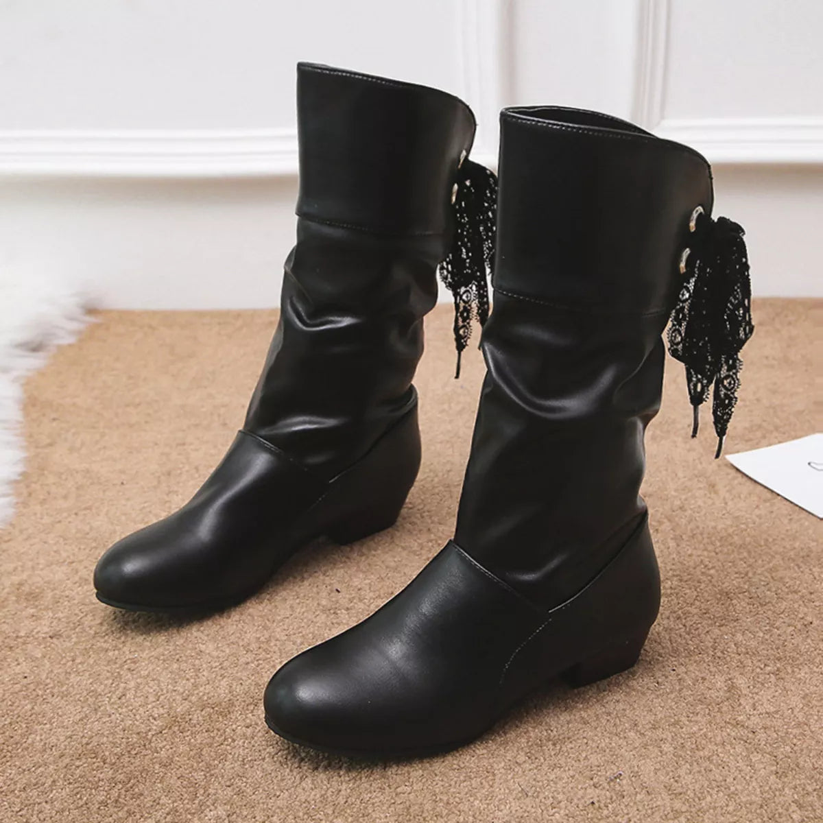 Round toe block heel boots heel and sole detail