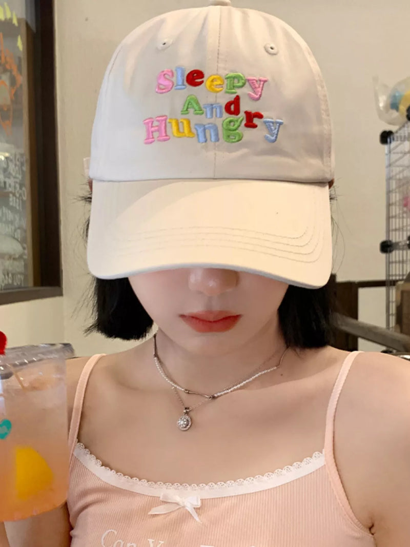 Letter embroidered baseball cap front