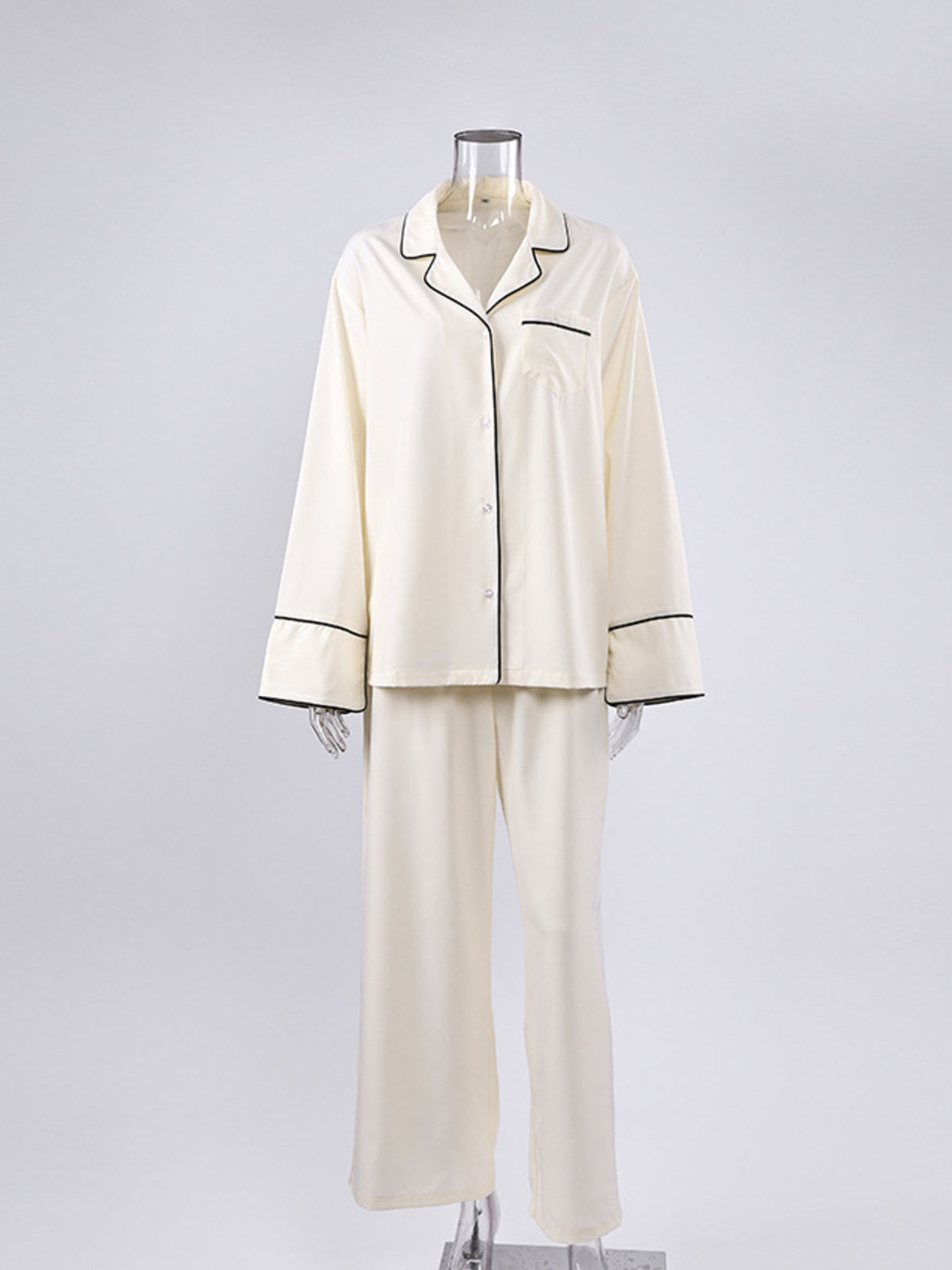 Contrast trim detail on beige button up lounge top