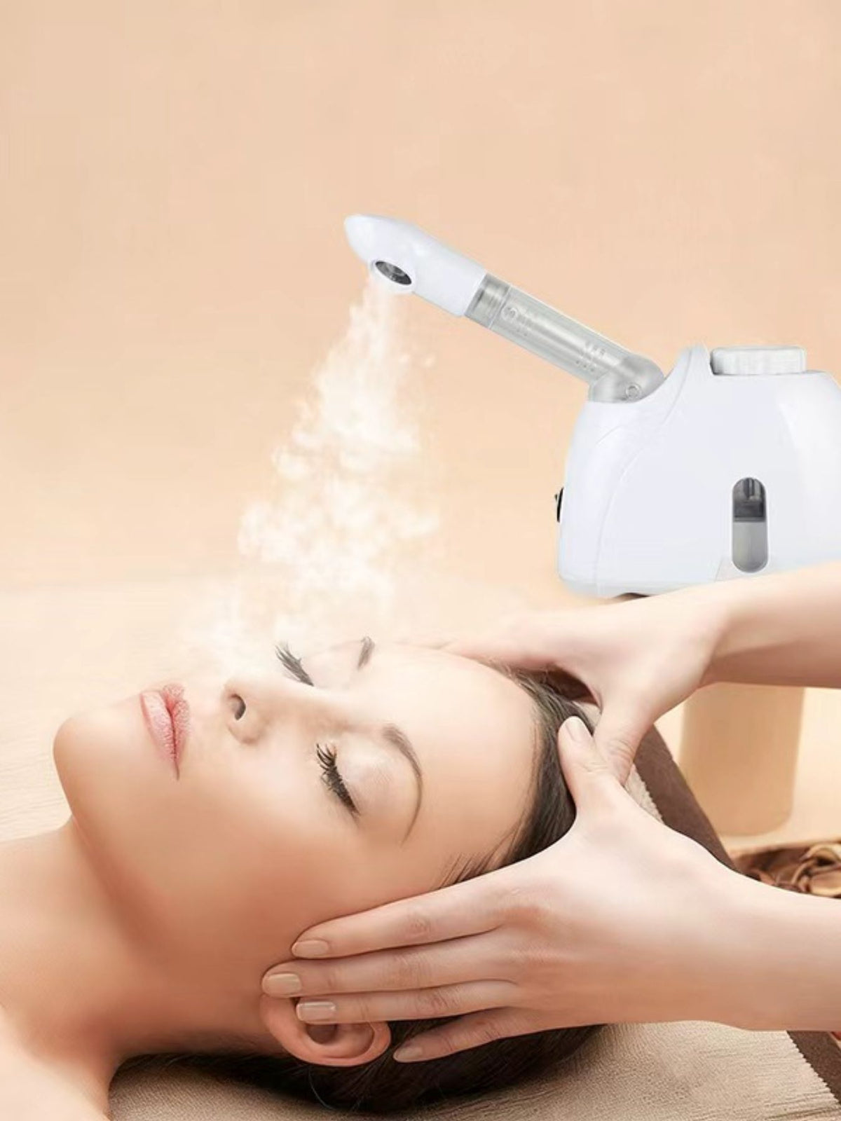 Facial steamer nozzle releasing steam close up