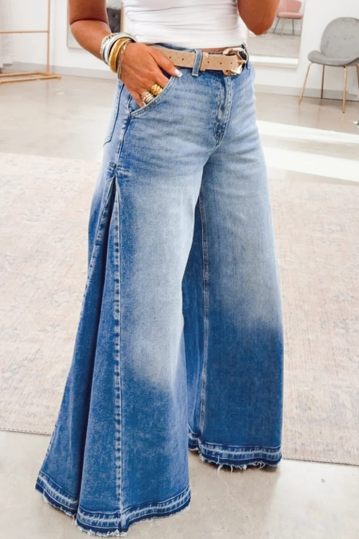 Back view of blue flare leg jeans with pocket detail