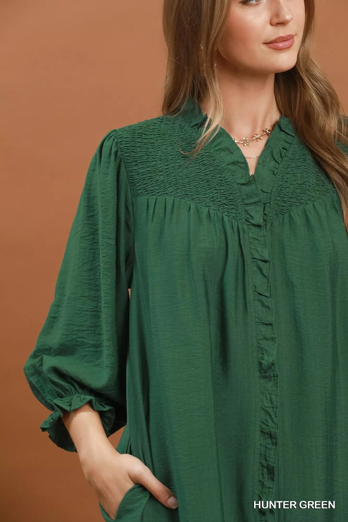 Back view of the green smocked ruffle mini dress