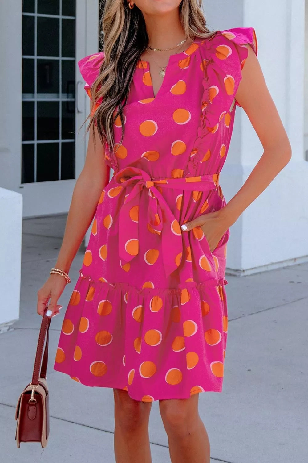 Polka dot mini dress side view showing skirt movement