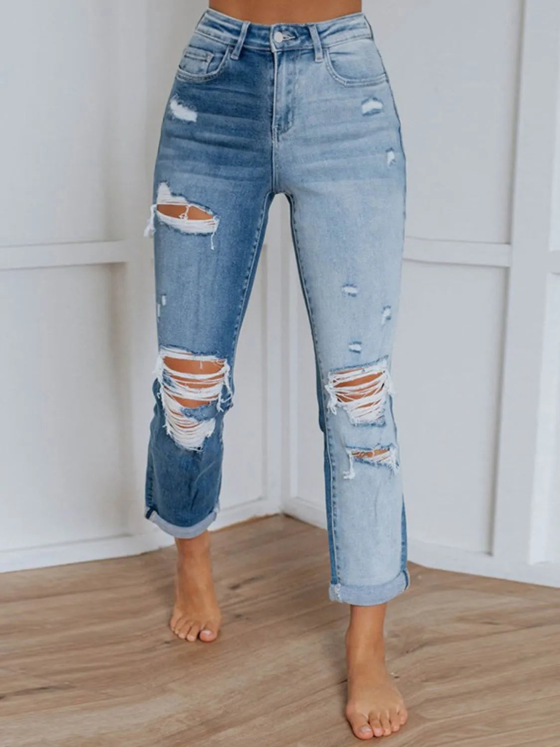Distressed light wash straight jeans front view