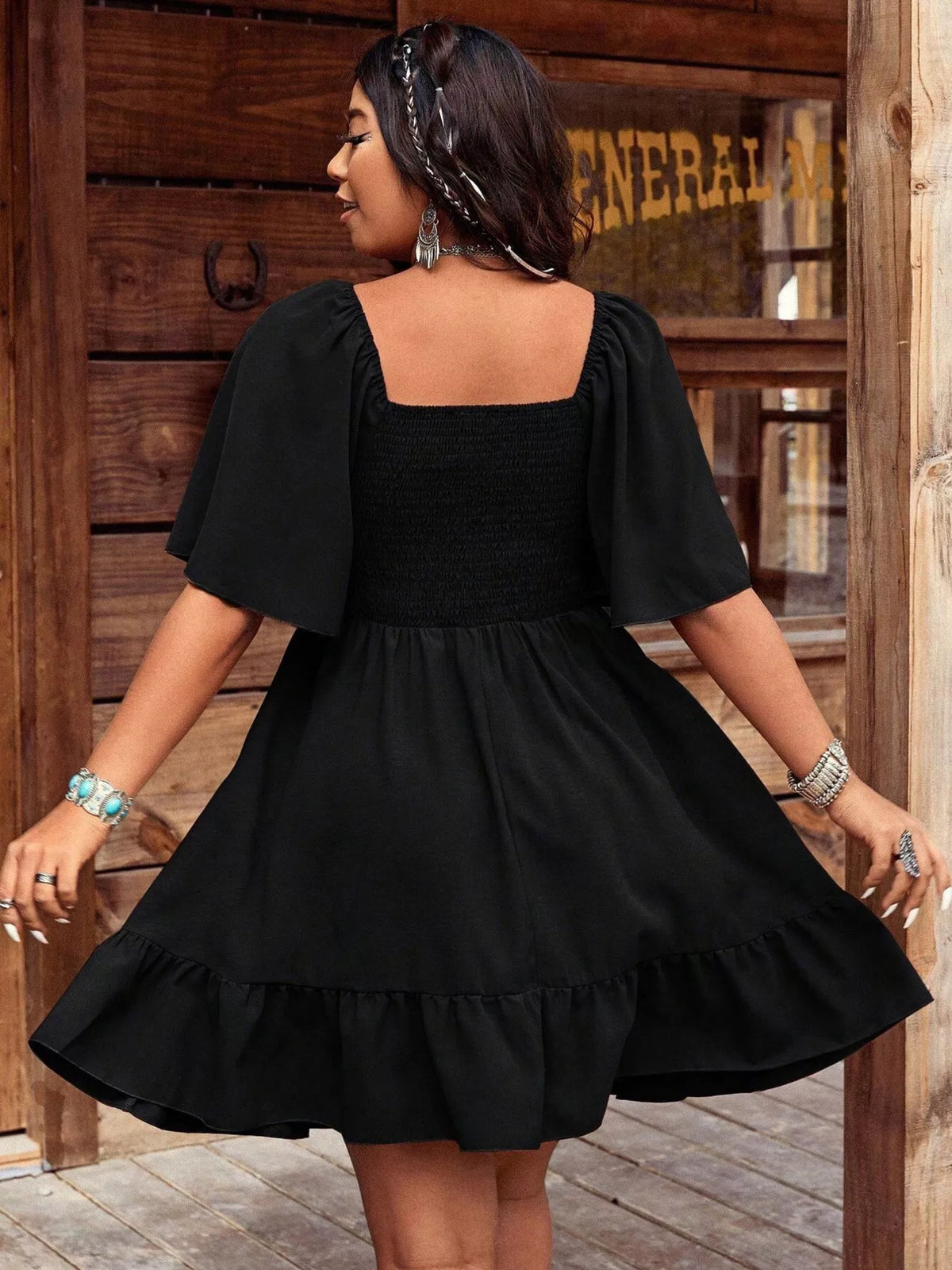 Hem detail of the flutter sleeve mini dress