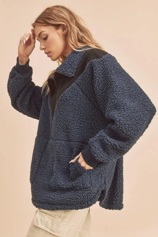 Navy fleece sweatshirt front pocket detail