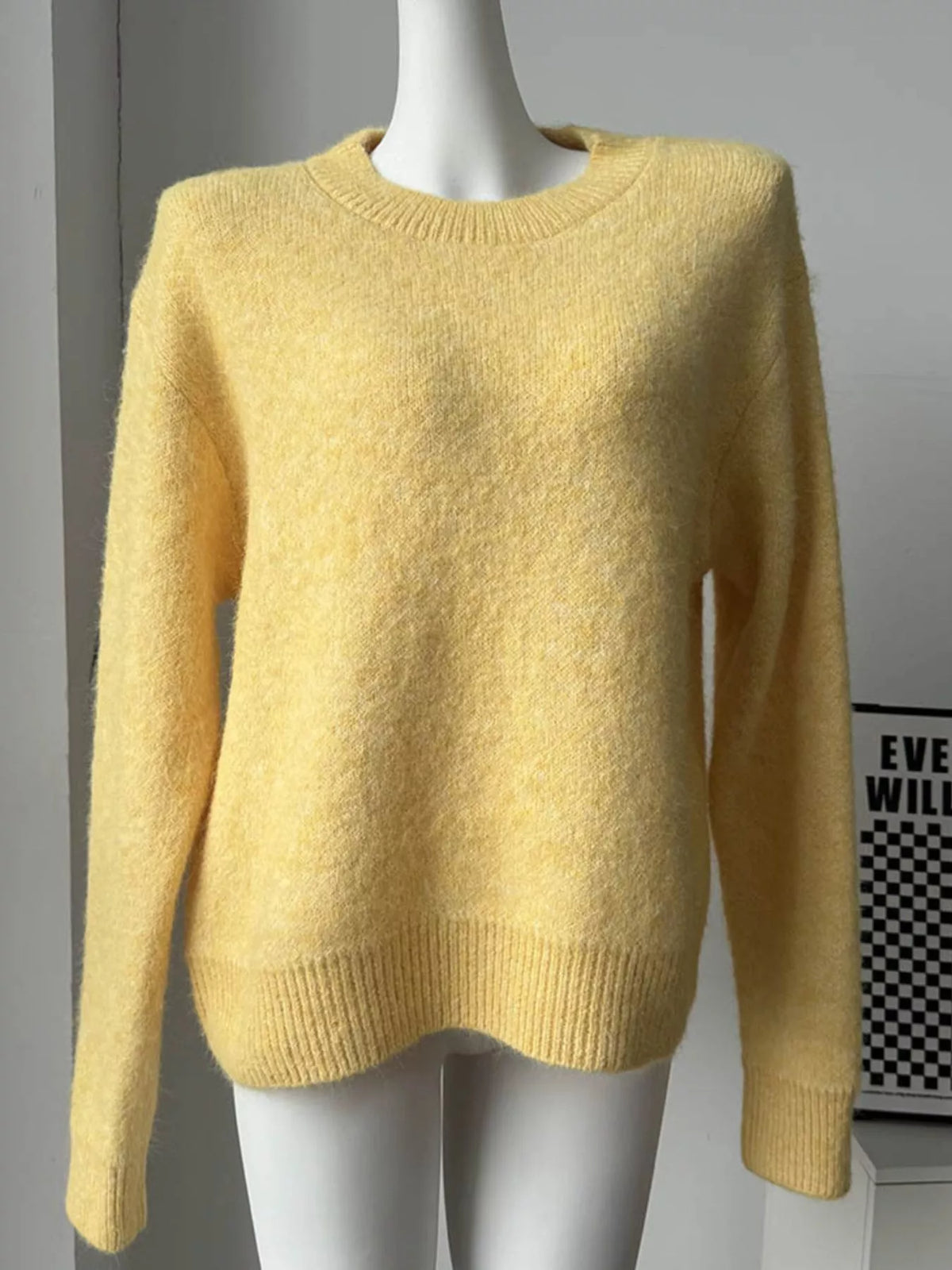 round neck dropped shoulder sweater sleeve and cuff detail