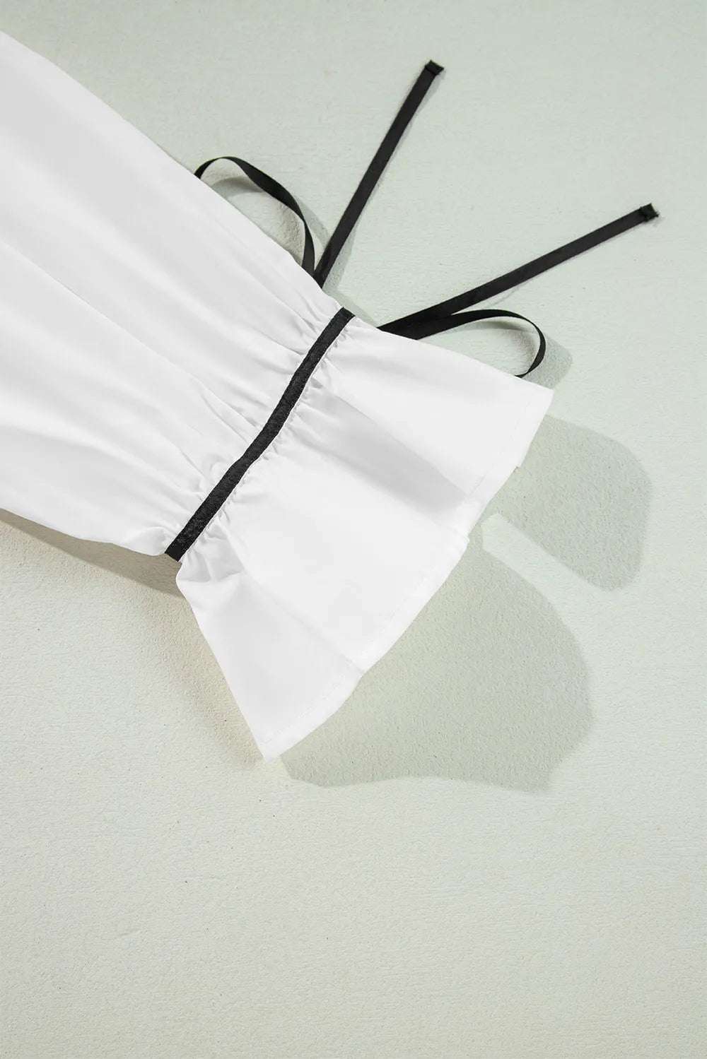 Flounce sleeve shirt worn with jeans
