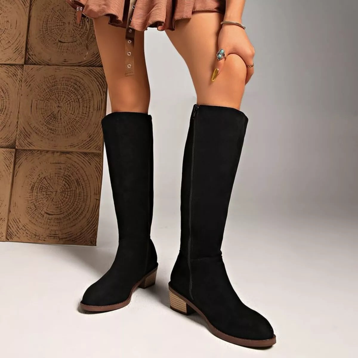 Knee high block heel suede boots close up detail