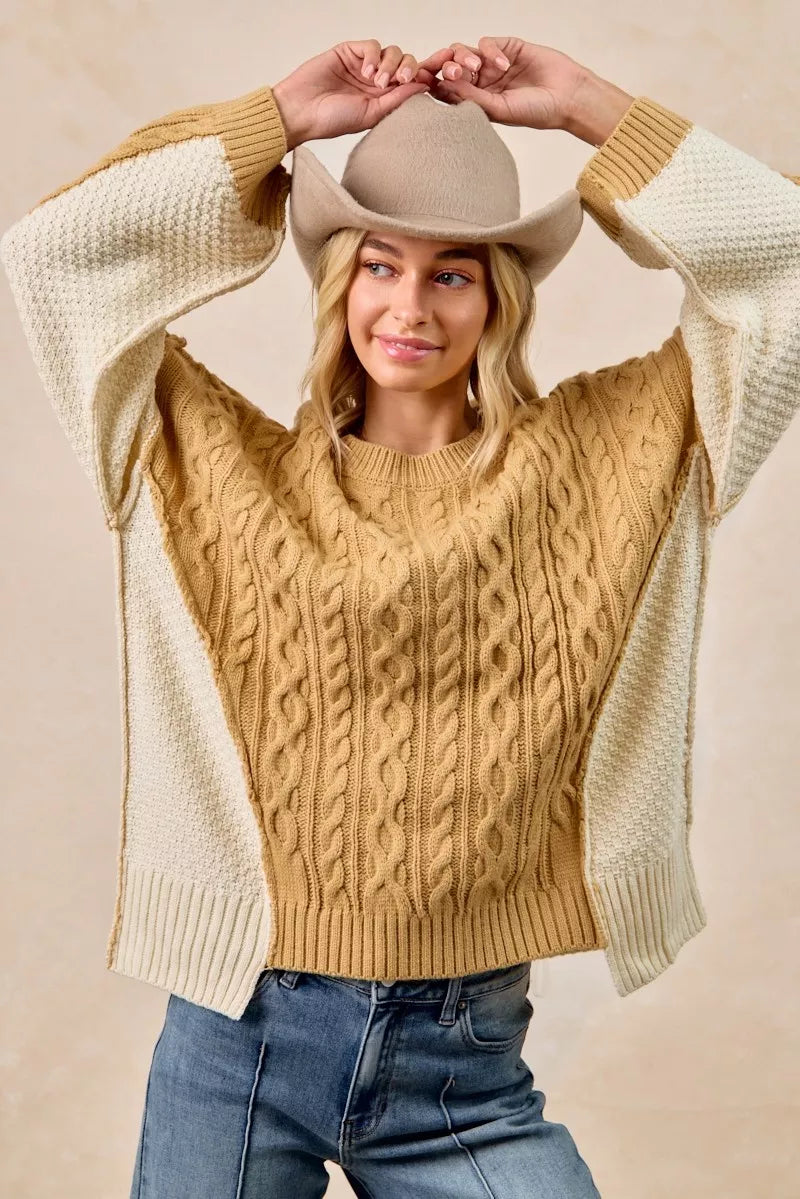 Cable Knit Uneven Hem Sweater in Mustard and Ivory on model