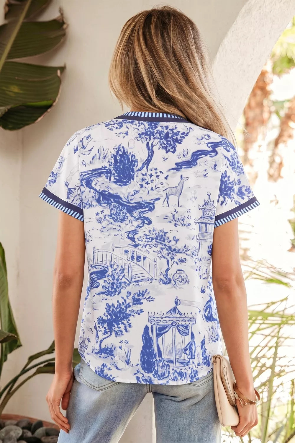 Light blue printed striped trim v neck blouse back view