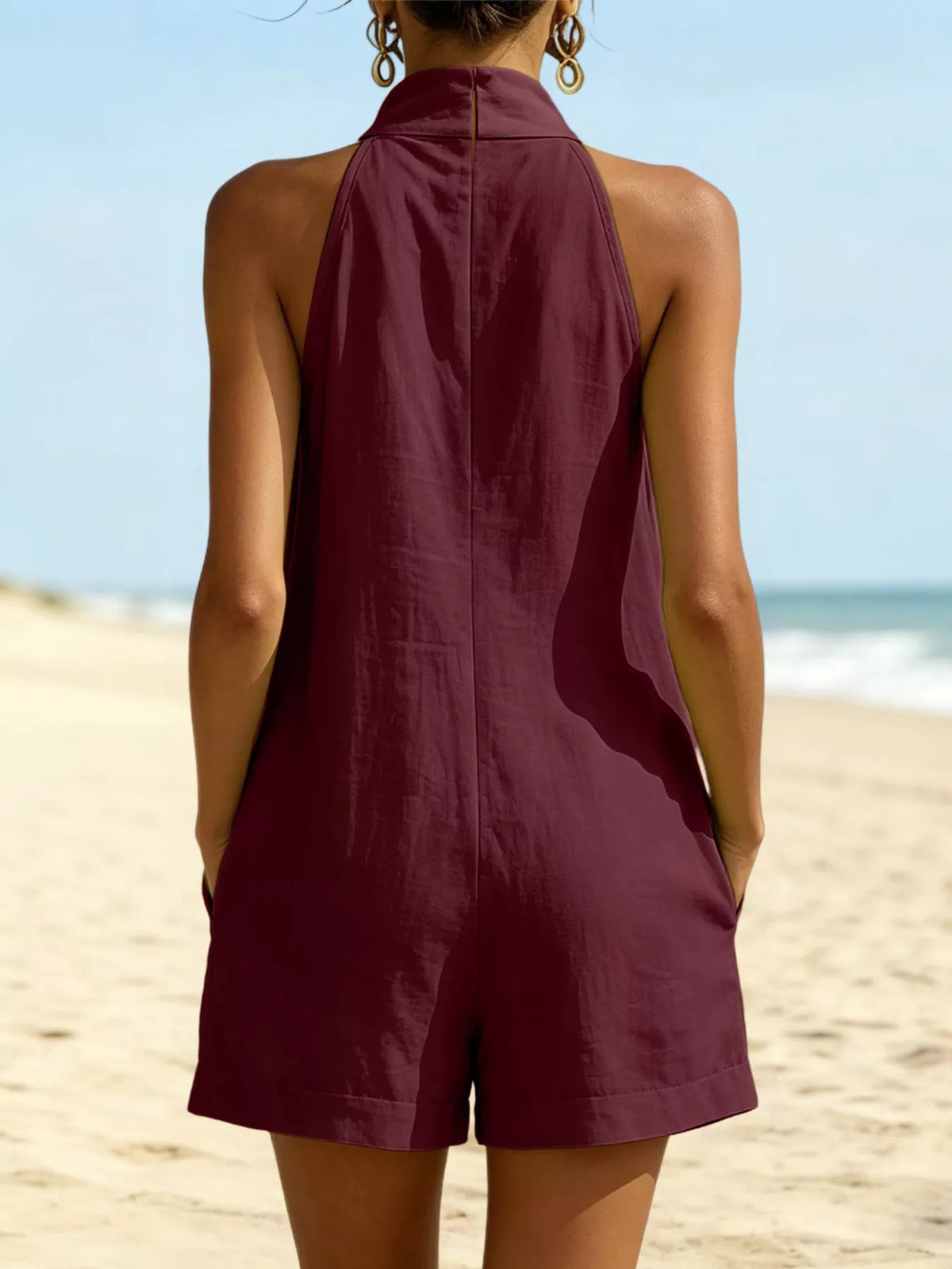 Halter neck romper with pockets close up view