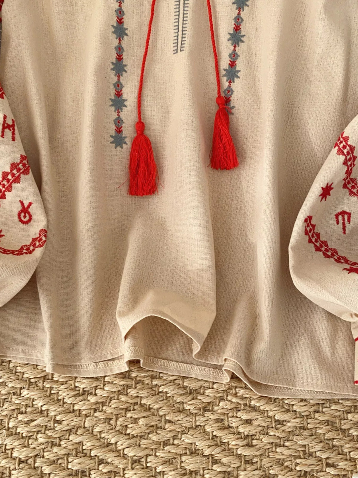Embroidered tie neck blouse styling detail