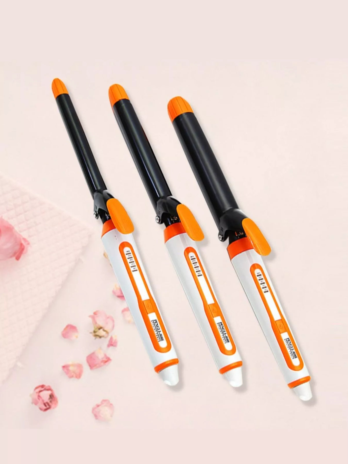 Curling wand held in hand