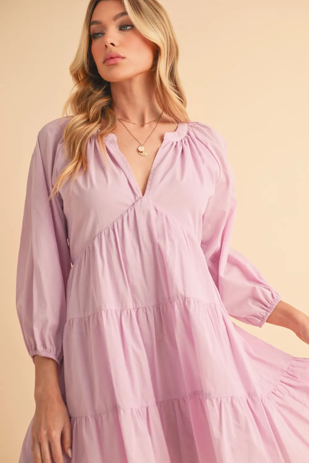 Notched balloon sleeve detail on lilac dress