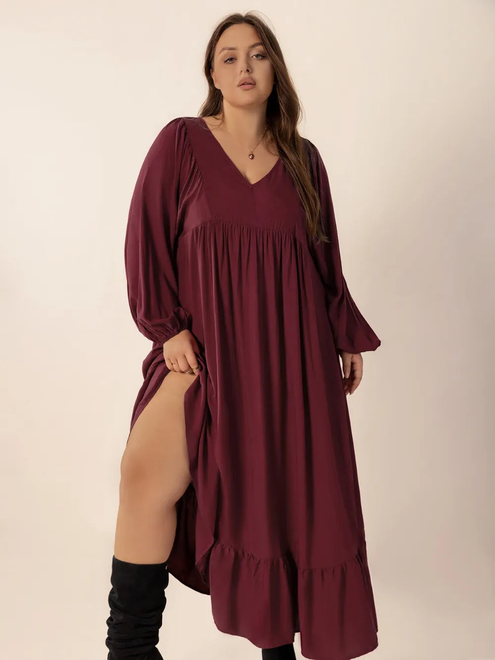 burgundy plus size ruffled hem v neck balloon sleeve dress on model