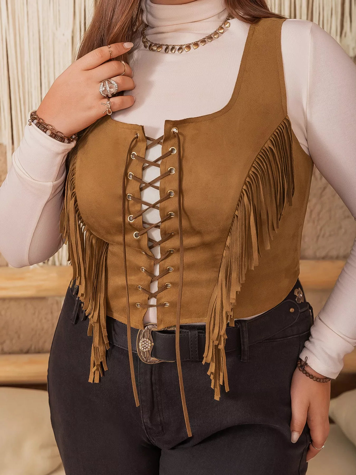 Side view of fringed suede vest