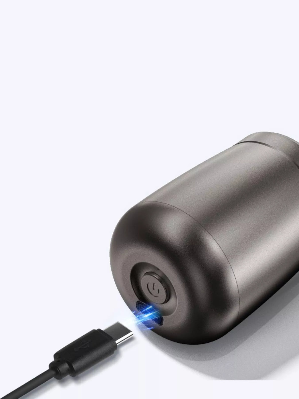 Electric shaver held in hand