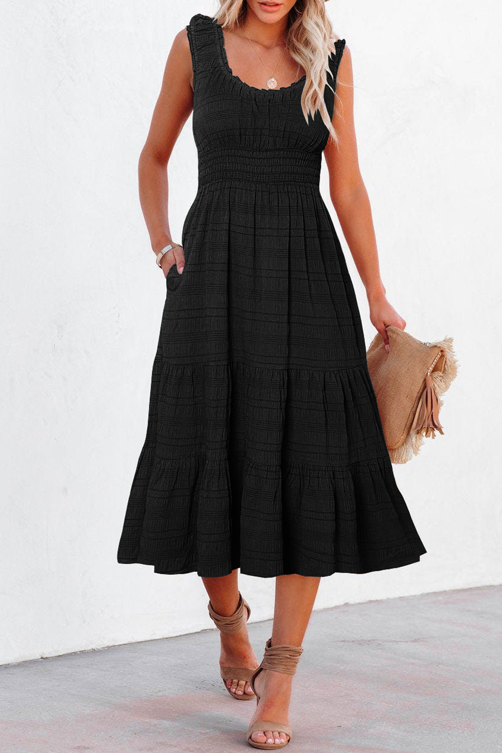 Sleeveless shirred midi dress styled with heels