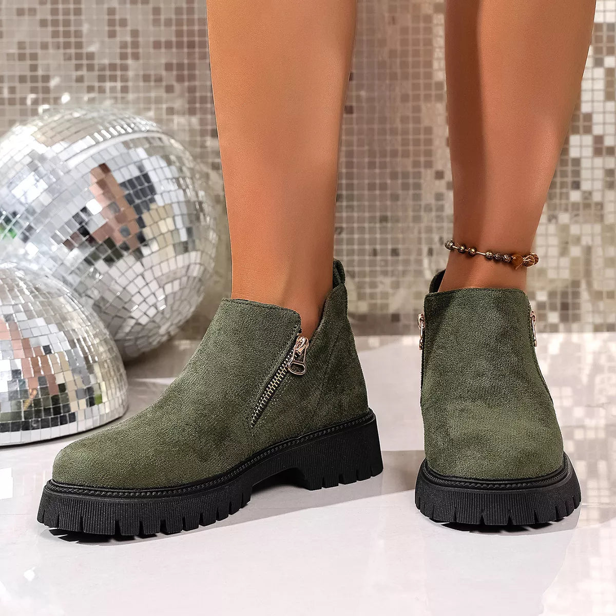 Round toe side zip ankle boots detail of the upper