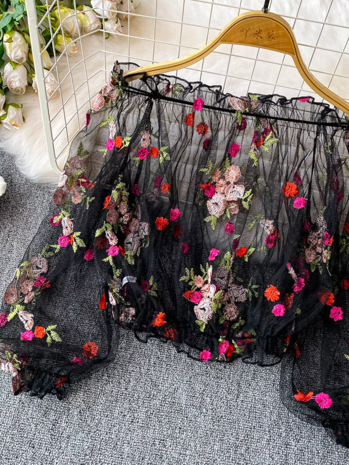 Sheer embroidered mesh top on model
