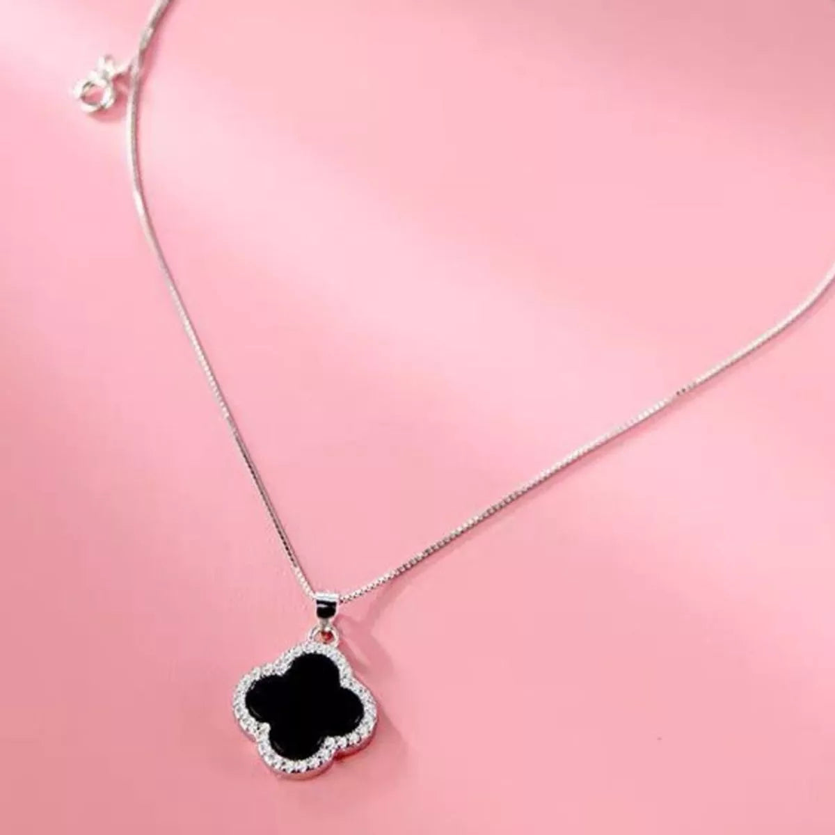 Agate clover pendant displayed with its matching box