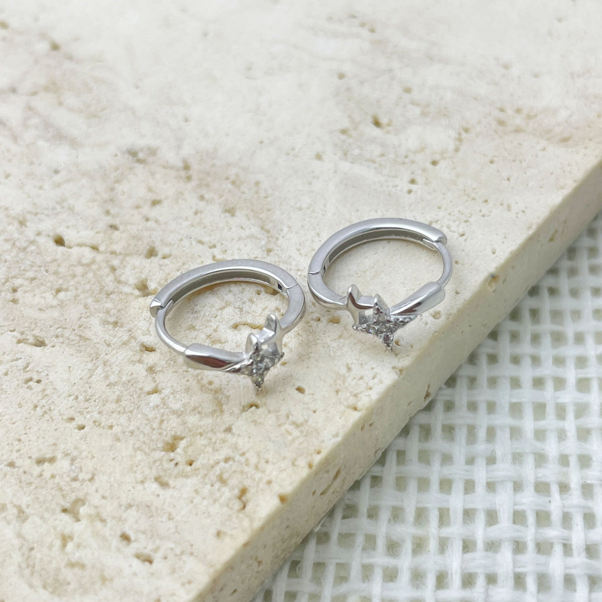 Side angle of the small silver hoop earring